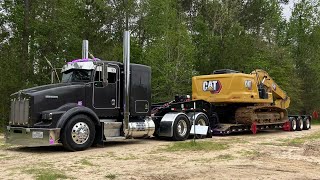 hauling oversize CAT excavator, RGN lowboy trucker