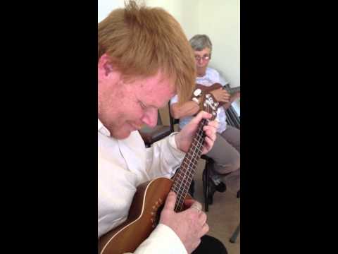 Strumming the ukulele