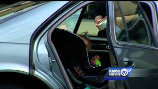 Police help save toddler trapped in car on hot day