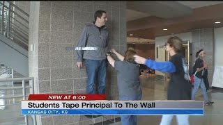 Students tape KCK principal to the wall for a good cause