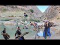 Nomadic life: cooperation in collecting firewood and transporting it with river water to the house