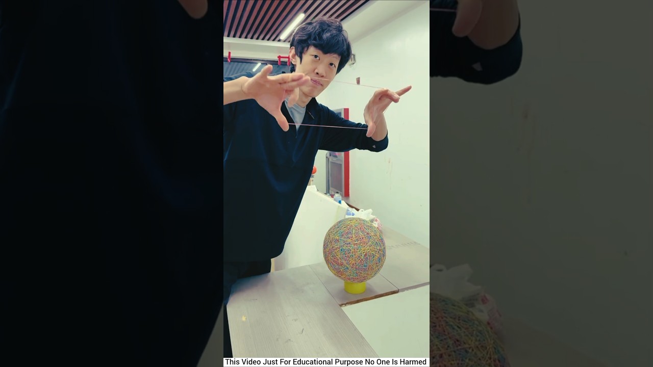 Can This Gay Make A Football Out of Rubber Bands? 