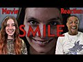 Smile 2022  movie reaction  our first time watching  its not what you think   crazy awesome