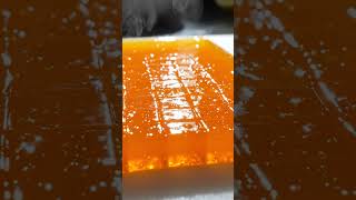 Shimmering orange jelly cubes diced under a gliding blade 🍊 #asmr #foodasmr #satisfying #shorts