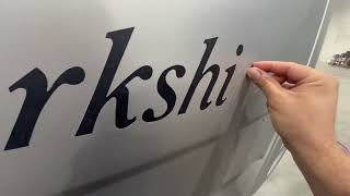 Dion re painting the front end of a luxury motor coach