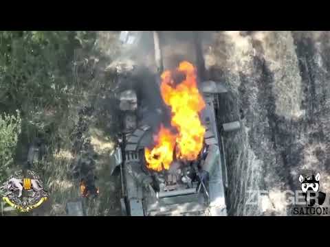 Moment Ukrainian Spec Ops Drone Drops Bomb Into Russian Tank's Open Hatch With Pinpoint Precision