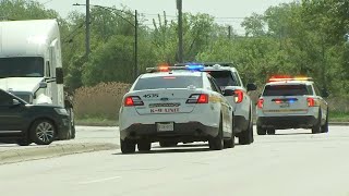 Suspect accused of robbing officer at gunpoint still on loose after chase ends in crash