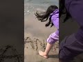 Amna Is Writing Her Name On Sand