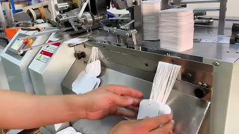 Automatic tag string attaching machine