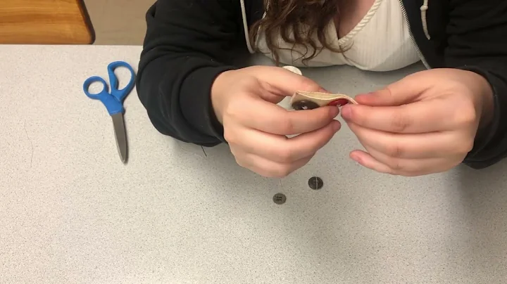How to sew on a button by Camryn and Sophia