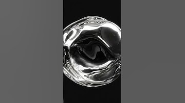 video of a liquid chrome metal-looking spherical blob on a black background floating in suspended...