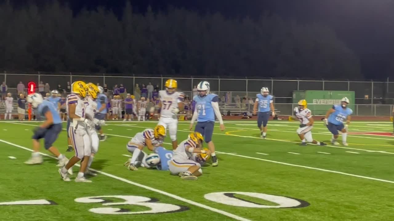 Kenneth Mullen runs up the middle for seven yards