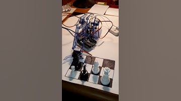 Micro Arm playing chess