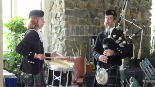 The Black Bear on Bagpipes and Drum