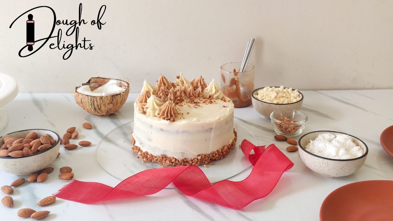 Almond Praline Coconut Cake with White Chocolate Frosting
