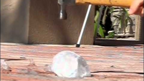 Chunks of ice hit with a hammer in slow motion