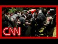 Watch moment police tear down protesters barrier at university of texas at austin