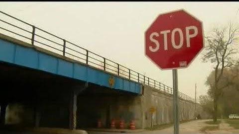 Drunk clown charged with dangling child from overpass