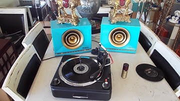 Zenith 4 speed automatic stereo record changer playing a 16 RPM record.