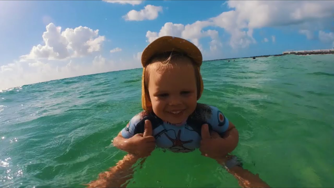 Naomi is swimming on her back for first time in the Ocean at Miami Beach