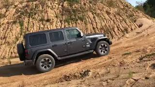 Jeep Wrangler Sahara stock attacks sand hill