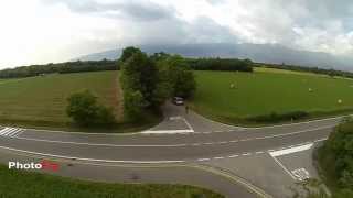 Drone flying over the corn field chasing a car