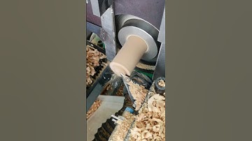 The automatic CNC wood lathe processes wooden eggs continuously.  #wood  #cnc