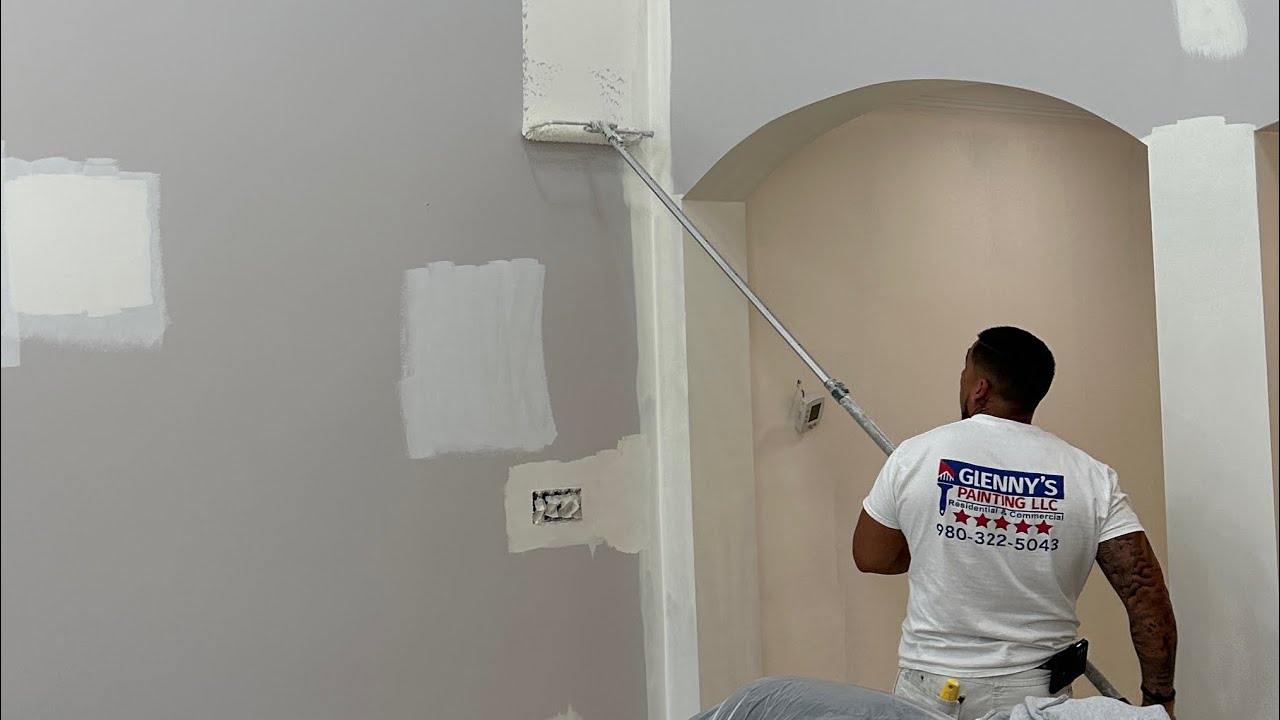Painting living room walls with Sherwin Williams Creamy. Charlotte NC