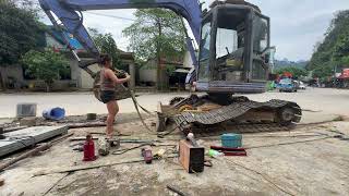 The genius girl was invited to maintain the excavator's track system.
