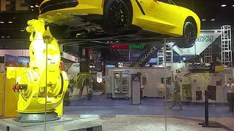 Fanuc huge robotic arm manipulating Corvette