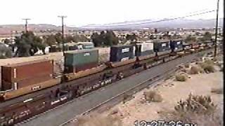 WB BNSF Intermodal -Bare Table Train Meets Stopped EB BNSF Bare Table Train @ East Barstow CA.wmv