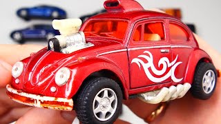 Various Model Cars Being Reviewed in Hands