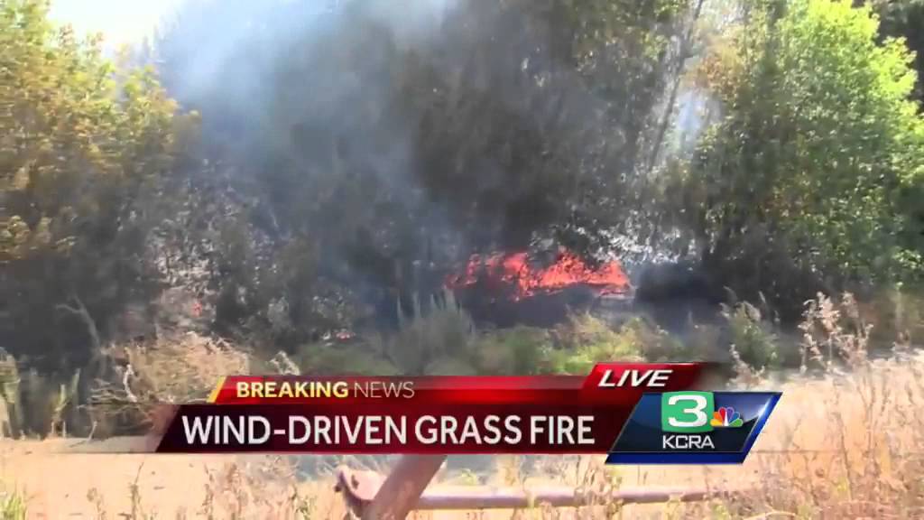 Wind-driven grass fire ignites one home in San Joaquin County - YouTube