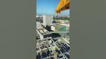 Tower crane hoisting steel structure building- Good tools and machinery make work easy