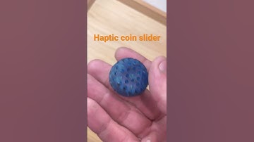 Haptic coin fidget slider clicky
