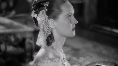 Bette Davis stirs up a dual (prelude to "Raise a R...
