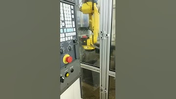 Robot loading and unloading parts into a Fanuc Robodrill