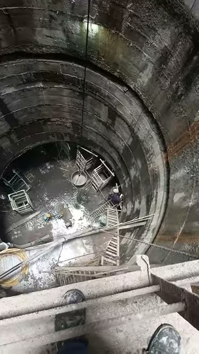 Shaft sinking.     shaft view from middle to top and bottom.