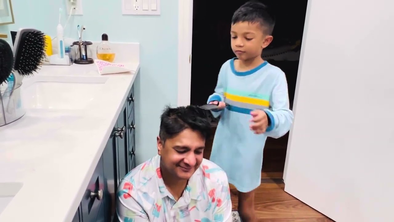Aaru and Riyu doing their dad’s hair! 