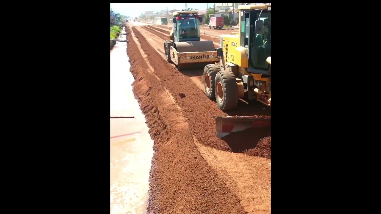 Smooth action of grading trimming for building road in countryside 