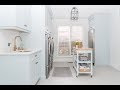 A pastel blue and brass laundry room you’ll actually want to spend time in