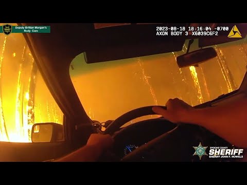 Flames Surround Deputy’s Car in Forest Fire