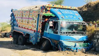 The Front Axle Of The Truck Broke As Its Brakes Failed And It Hit The Wall Along The Road