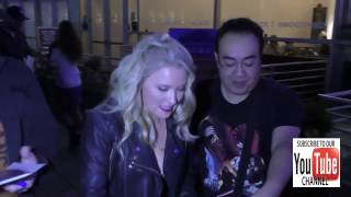 Emily Osment talks about wearing high heels outside ArcLight Theatre in Hollywood