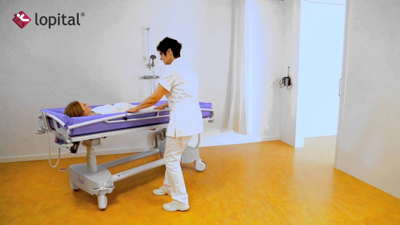 Lopital - Lehrvideo - Luxal Elektrisch höhenverstellbar Duschwagen (DE)