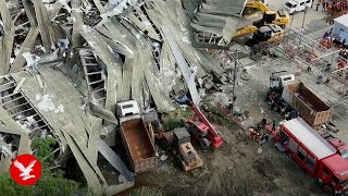 Workers buried under mountain of garbage after deadly landfill collapse