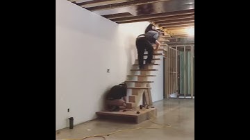 Walnut Wood Mono-stringer with Waterfall Slab Landing