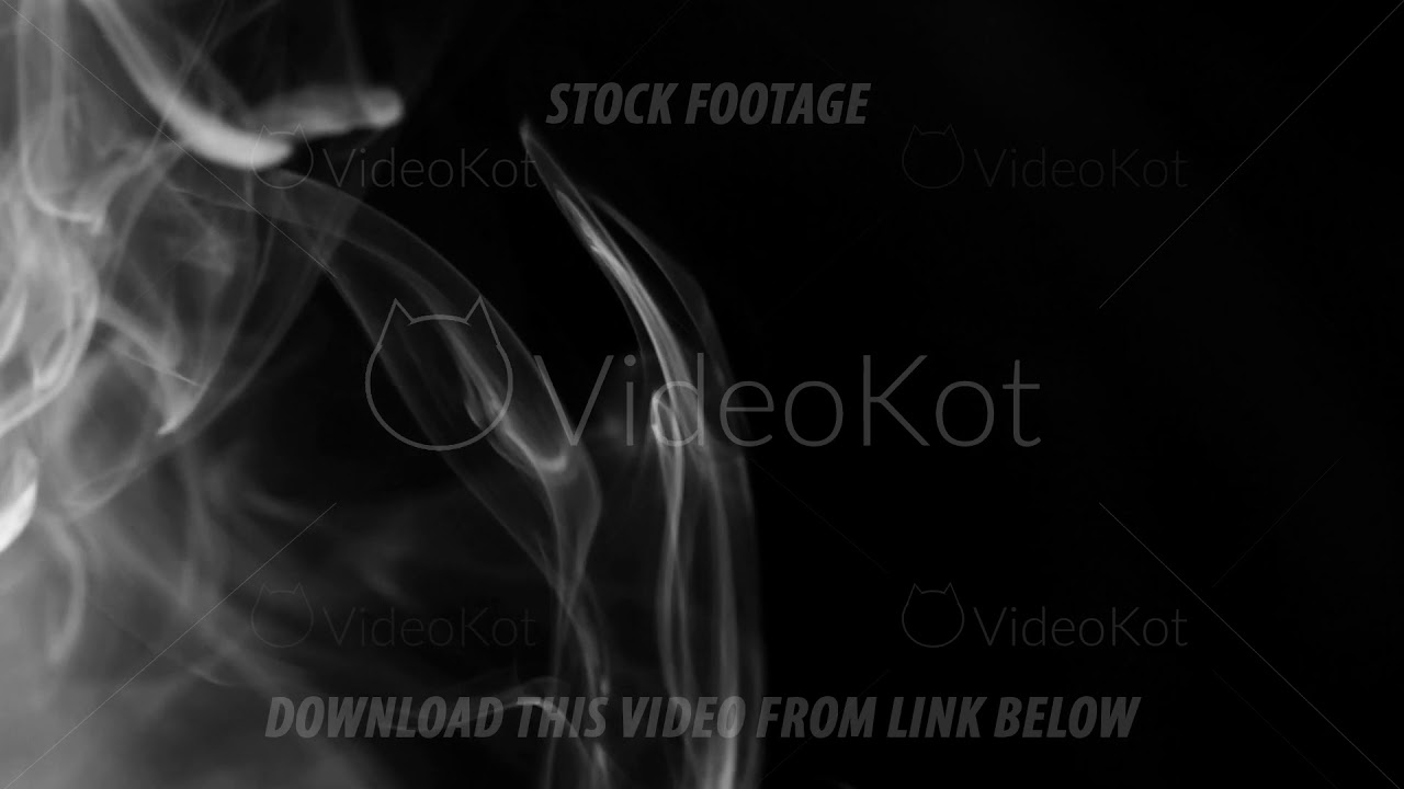 Plumes of real white smoke on a half frame on a contrasting black background