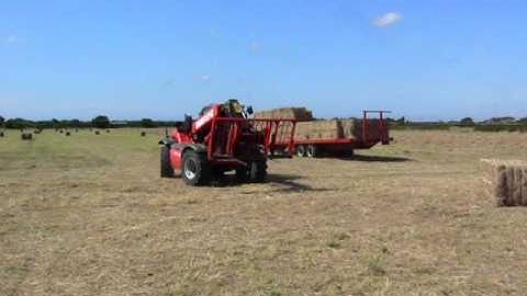 martland manitou loading big bales.