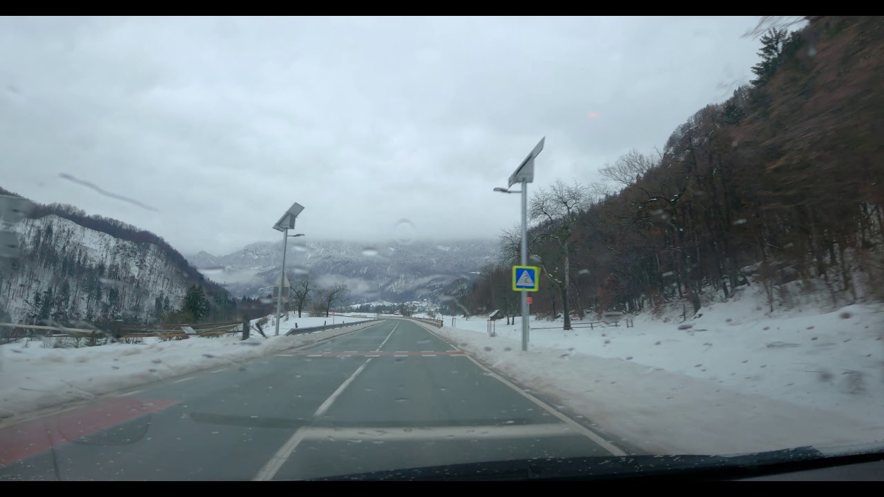 Scenic drive through snowstorm in alpine valley towards lake Bohinj - Relaxing ambient music